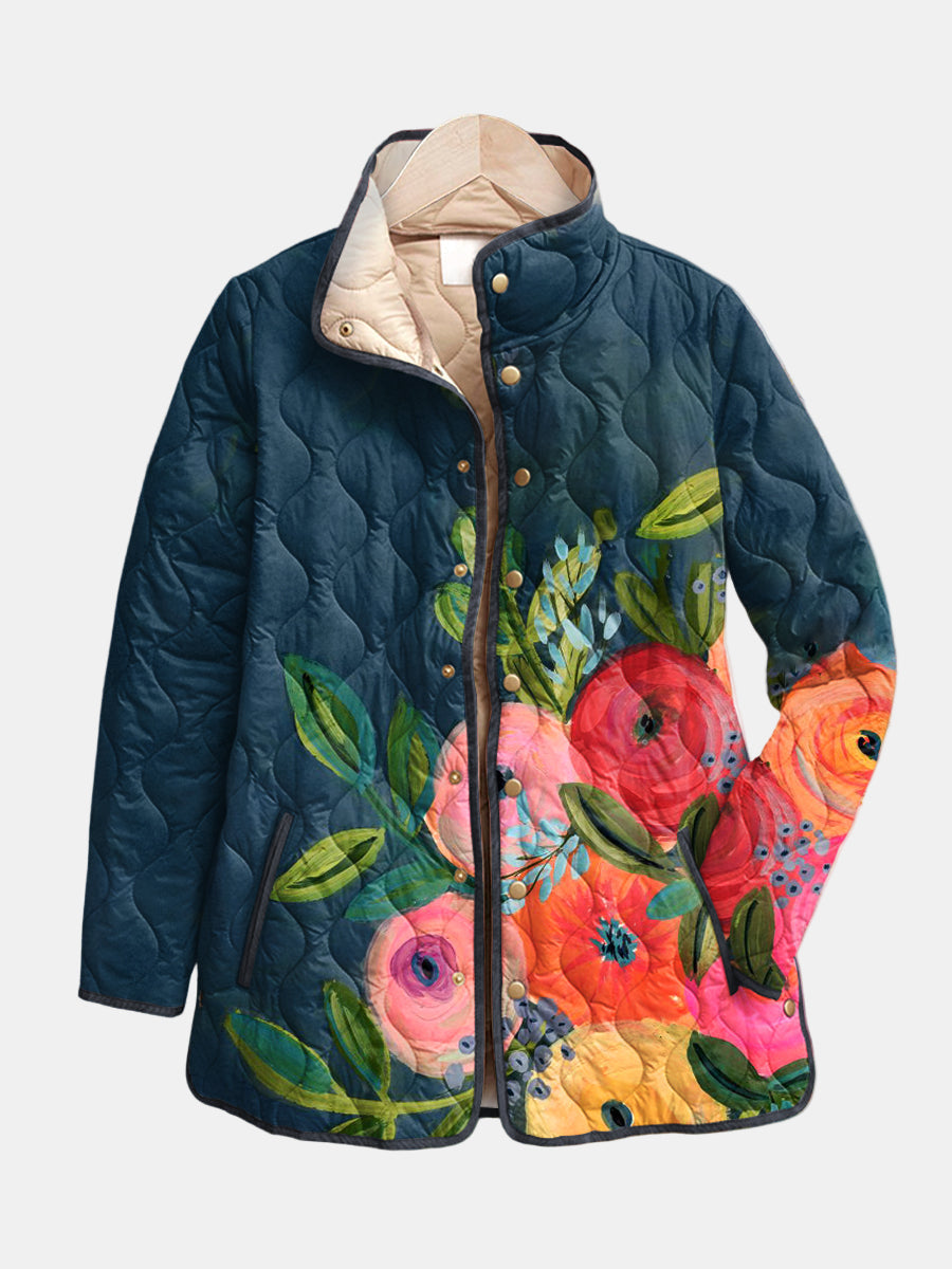 Navy floral print quilted jacket with snap buttons, front view