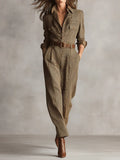 Khaki utility jumpsuit with belted waist and wide leg, front view