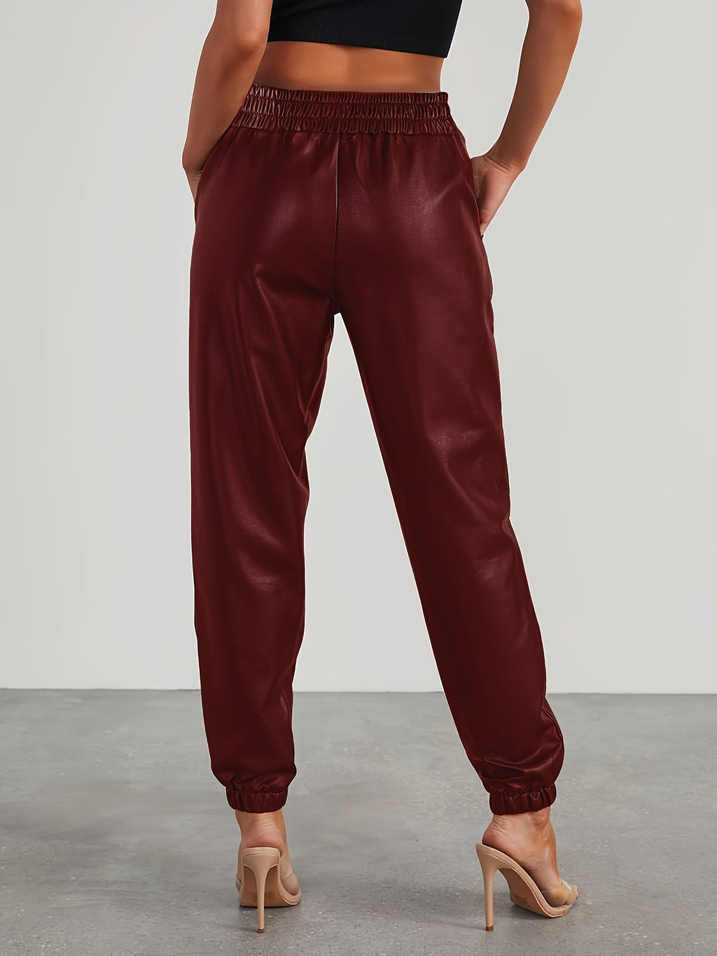 Tapered faux leather pants