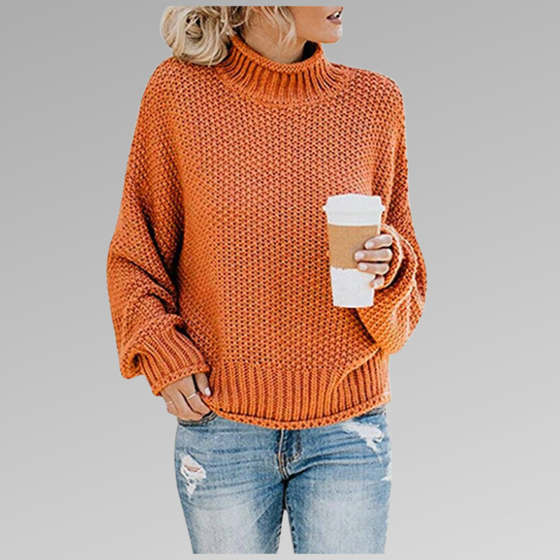 Orange chunky knit turtleneck sweater with drop shoulder sleeves, front view