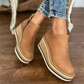 Khaki suede wedge ankle boots with side zip and platform sole, front view