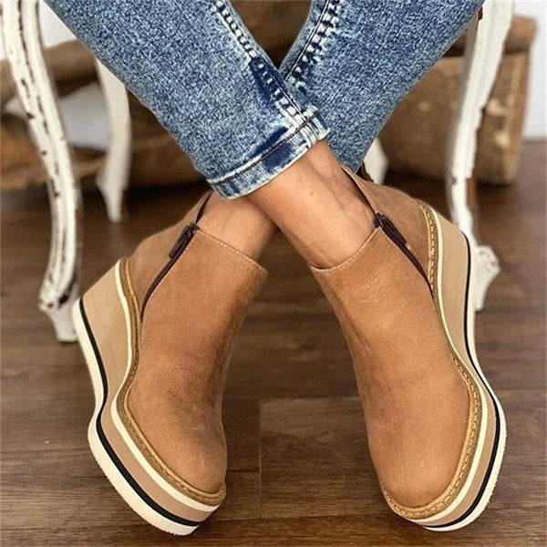 Beige suede wedge ankle boots with side zip and platform sole