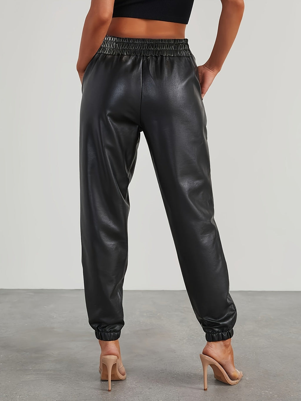 Tapered faux leather pants